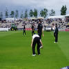 New Zealand players warming up with Chris Harris in the foreground