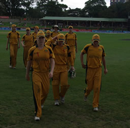 The Australian players coming off the field at the end of the New Zealand innings
