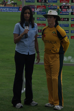 Australian Southern Stars captain Karen Rolton chats to a member of the broadcasting team at the end of the New Zealand innings