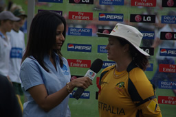 Australian Southern Stars captain Karen Rolton chats to a member of the broadcasting team at the end of the New Zealand innings