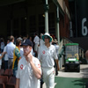 Paul Collingwood and Alistair Cook walk out onto the field