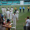 Andrew Flintoff leads England off the field at the close of play