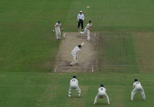 New Zealand batsman hits the ball into the off side
